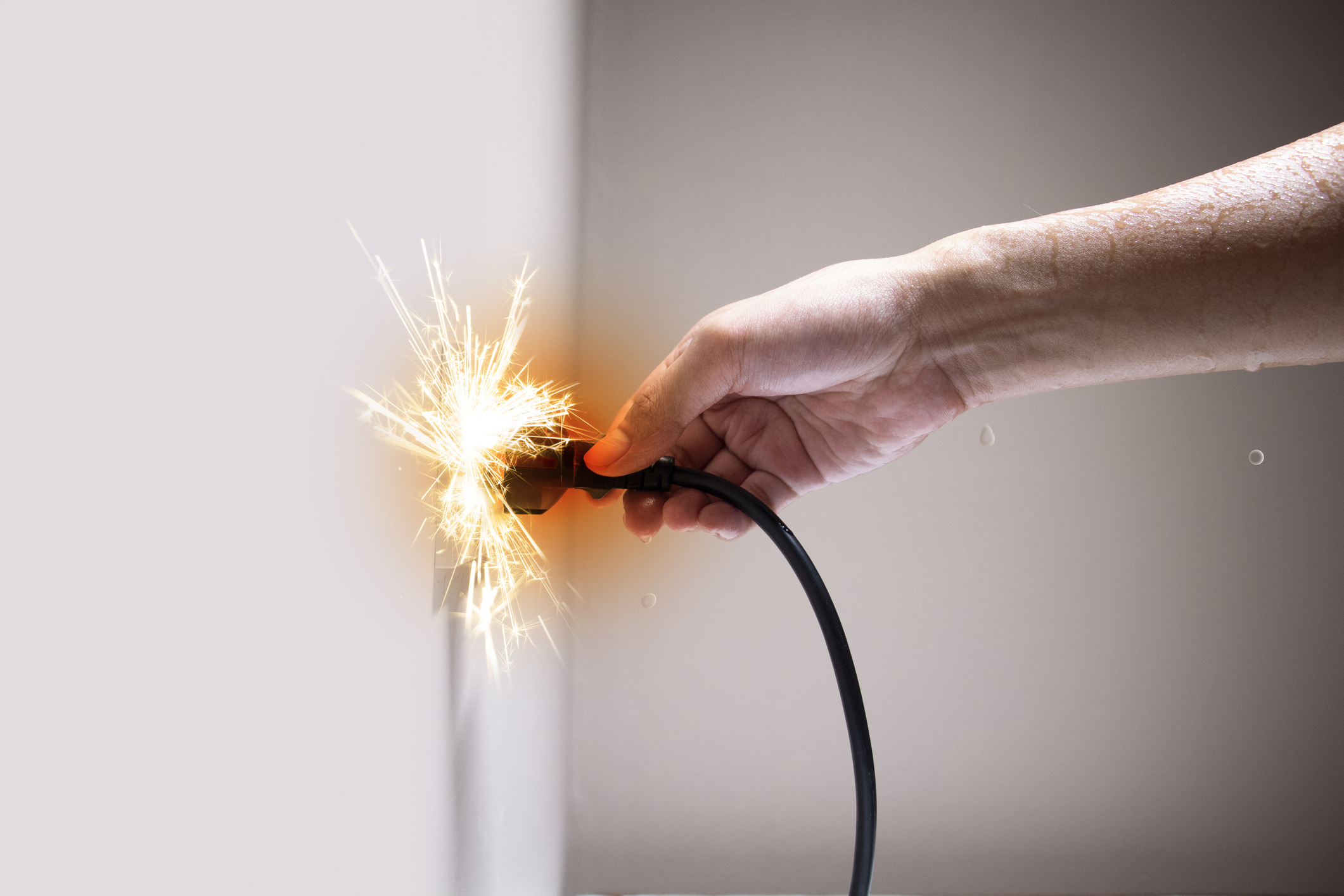 Sparks while plugging cord into socket