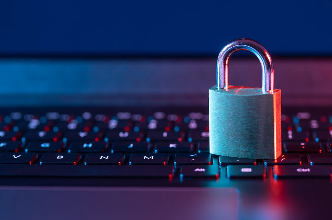 A padlock rests on a computer keyboard