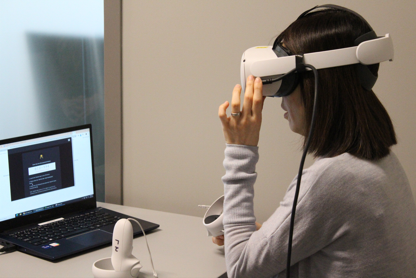 A woman wears a virtual reality headset