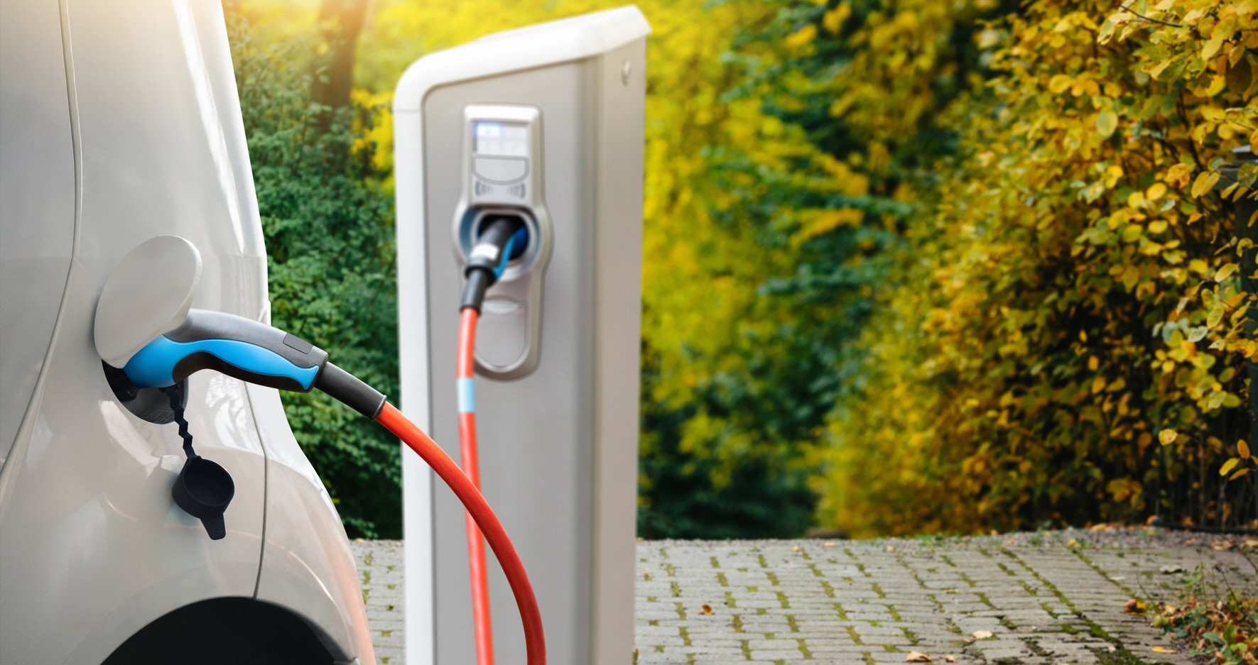 An electric car plugged into a charging station