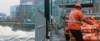 Hydro Ottawa employees working on sandbags for the Flooding 2019