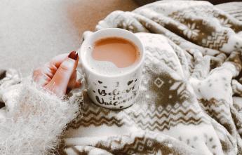 person-holding-coffee-filled-mug