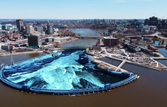 A blue visual effect highlights the Ring Dam at Chaudière Falls on the Ottawa River