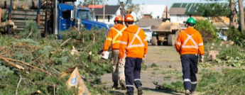 Workers on the field during the tornado in 2018