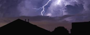 Lightning strike in a dark neighbourhood during a power outage