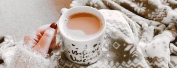 person-holding-coffee-filled-mug