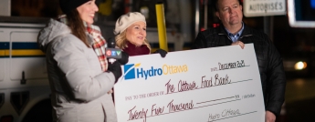 Hydro Ottawa CEO presents a cheque for $25,000 to the Ottawa Food Bank