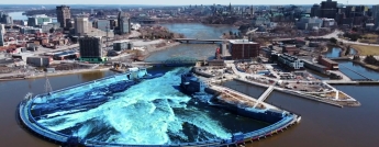 A blue visual effect highlights the Ring Dam at Chaudière Falls on the Ottawa River