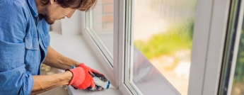 Person sealing window