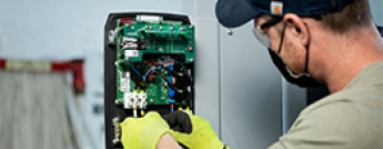 man installing ev charger