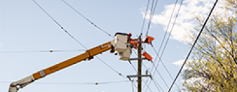 Power line worker in a bucket truck