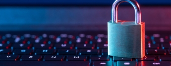 A padlock rests on a computer keyboard